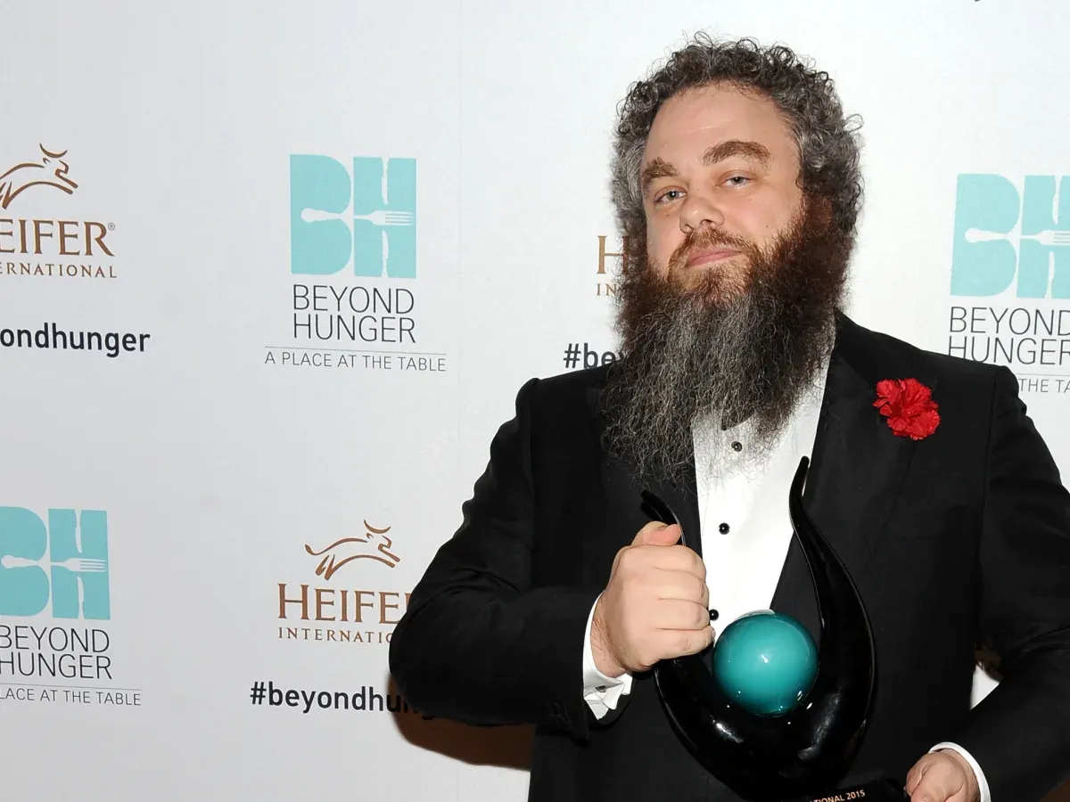 Patrick Rothfuss in Black Suit Standing in Beyong Hunger