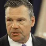 AG Kobach signs on to challenge over Mass. student's controversial shirt